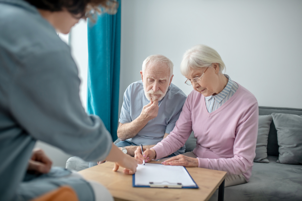 Senior couple having an appointment with health insurance agent